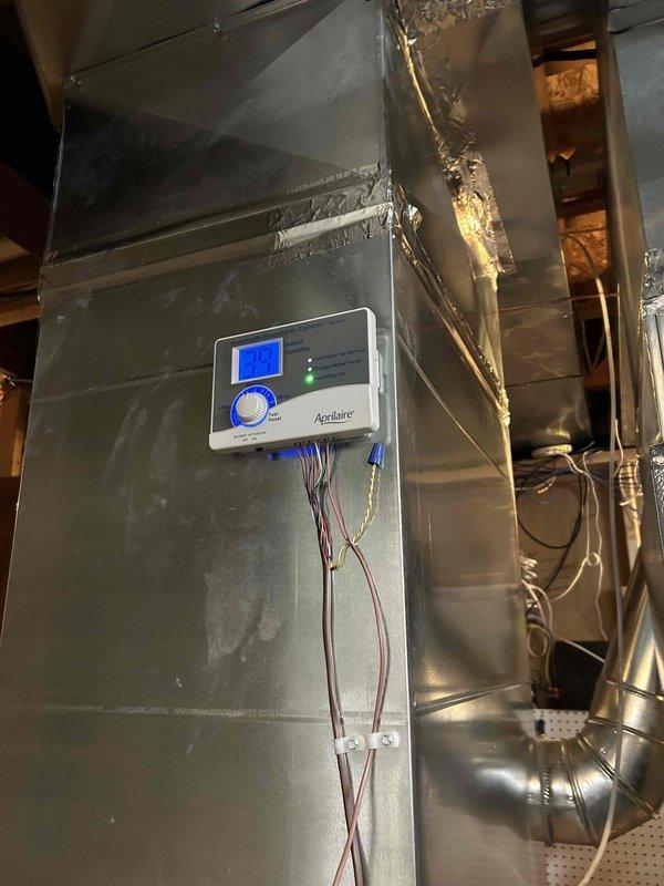 Successfully installed replacement furnace with proper flue pipe inspection and configuration. Installed and connected Aprilaire control system with appropriate wiring. Verified proper ventilation through the dual PVC Y-configuration exhaust system and ensured all connections were properly sealed with metal tape at seams.