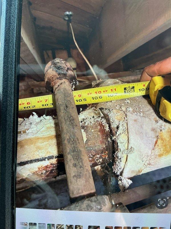 Inspected steam boiler system and found severe pipe corrosion with active leak under kitchen area. Documented extensive deterioration with measurements and photos, noting rust damage to surrounding wooden structural elements. Customer advised that asbestos-wrapped sections cannot be serviced until proper remediation, and temporary leak containment options were discussed pending professional asbestos abatement.