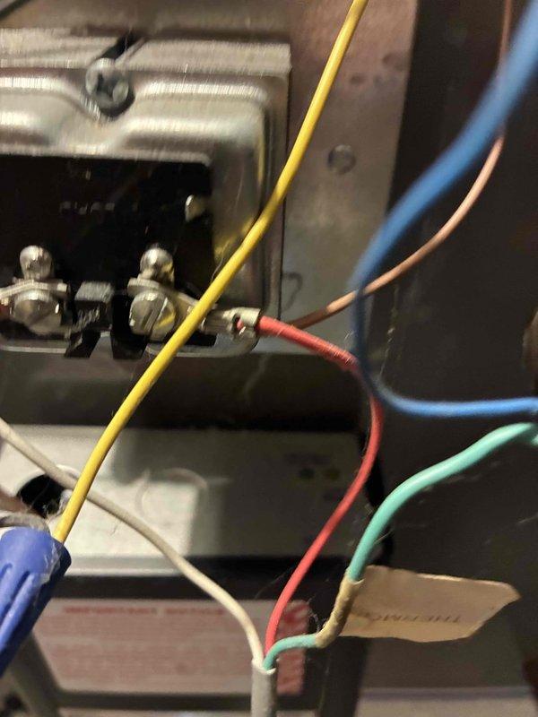 Responded to service call regarding boiler producing smoke and odor. Upon inspection, discovered damaged electrical connections within the boiler system, with multiple wires (yellow, blue, red, green, and white) requiring proper terminal reconnection. Repaired loose wiring connections and verified proper operation of the unit with no further smoke or odor issues.