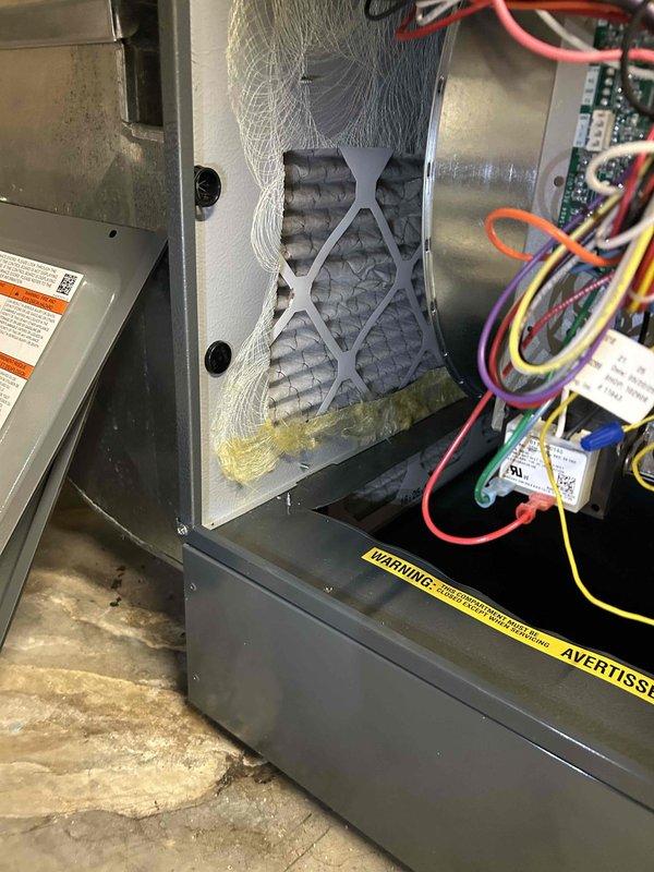 Performed warranty inspection on furnace system, identifying heavily clogged air filter causing operational issues. Accessed control board to verify proper electrical connections and component functionality, then replaced filter and cleaned accumulated debris from blower assembly.