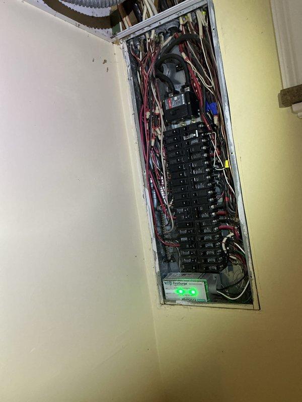 Completed electrical inspection of residential service panel. Examined breaker panel configuration, wiring connections, and circuit distribution. Also observed plumbing infrastructure including copper supply lines, PVC drainage, and gas line in utility area.