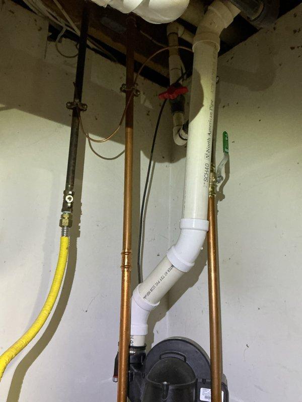 Completed electrical inspection of residential service panel. Examined breaker panel configuration, wiring connections, and circuit distribution. Also observed plumbing infrastructure including copper supply lines, PVC drainage, and gas line in utility area.