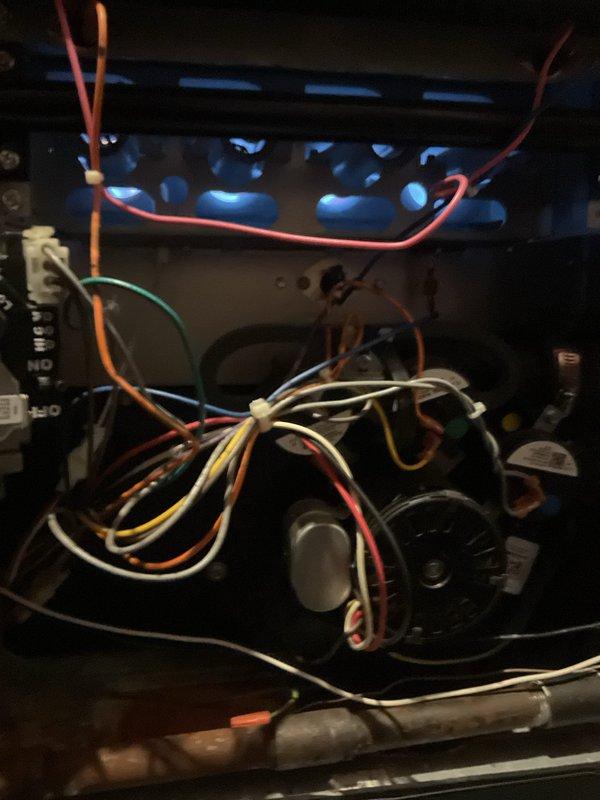 Performed scheduled heating maintenance on residential furnace system. Inspected internal electrical components including wiring connections and blower motor assembly. Examined ventilation configuration with PVC exhaust piping and verified proper installation of control sensor.