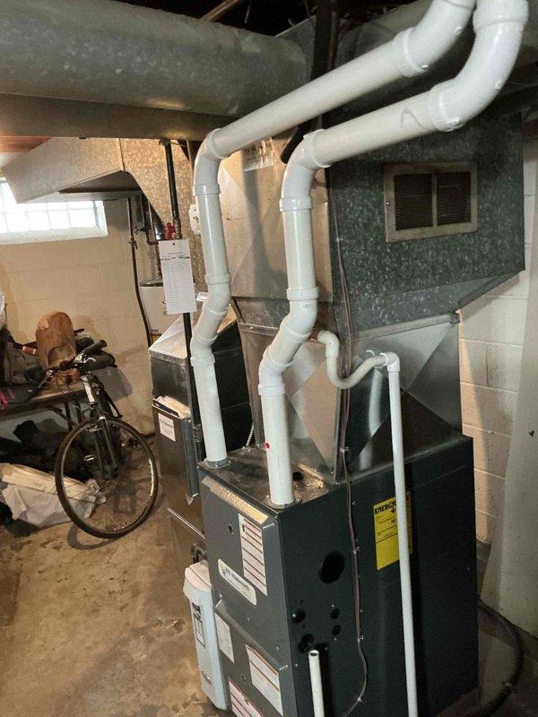 Performed assessment of existing HVAC system in basement mechanical room, including inspection of furnace unit with attached PVC ventilation piping and electrical connections at breaker panel. Documented current equipment condition and electrical service capacity to prepare replacement options for aging AC system. Completed comprehensive evaluation to determine appropriate sizing and compatibility requirements for new air conditioning installation.