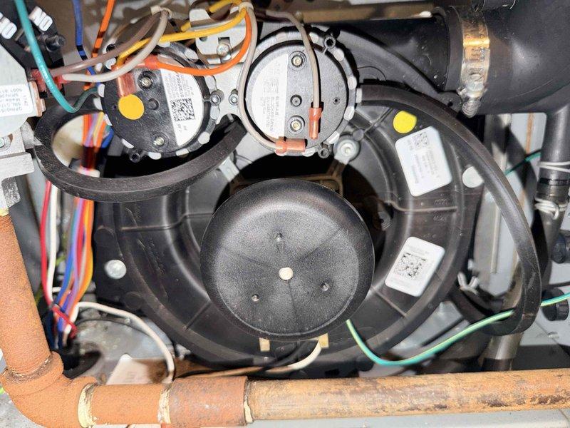 Completed routine heating maintenance on customer's system. Inspected electrical connections and wiring harnesses for proper termination and security. Examined blower assembly, pressure switches, and copper lines, noting normal oxidation consistent with standard system age and operation. All components functioning properly with no issues identified.