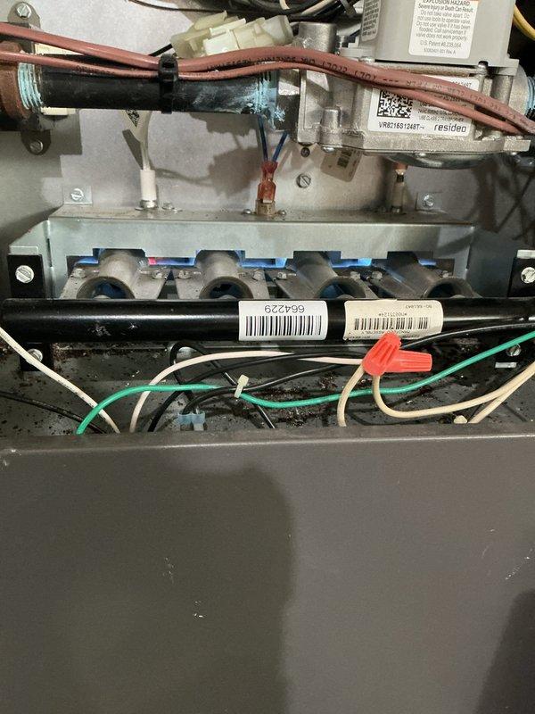 Replaced faulty thermostat and EIM unit under limited warranty. Performed system inspection of basement-installed HVAC system with proper ductwork connections. Verified proper operation of burner assembly and control wiring after installation.