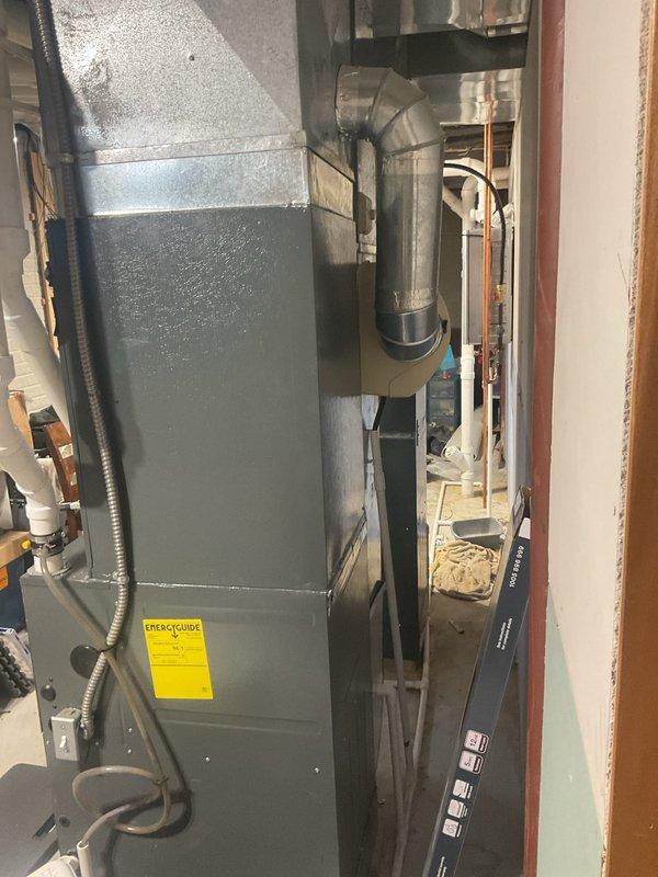 Responded to indoor air quality complaint regarding odor from forced heat system. Inspected furnace unit and ductwork in utility room, noting damp/burning smell reported by customer. Replaced air filter and checked for electrical issues; verified proper ventilation and operation of system to address reported IAQ concerns.