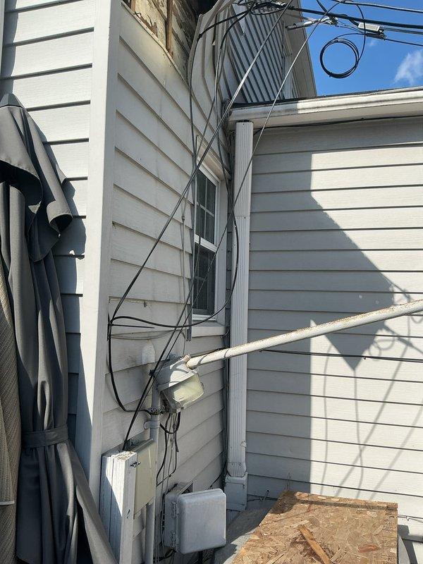 Performed inspection of outdoor condenser unit following reported ice damage. Visual assessment revealed multiple exposed utility cables and connections near the unit. Documented exterior conditions with photos, noting potential impact areas where ice detachment affected the system. No immediate repairs conducted at this time; comprehensive evaluation completed.