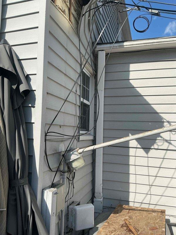 Performed inspection of outdoor condenser unit following reported ice damage. Visual assessment revealed multiple exposed utility cables and connections near the unit. Documented exterior conditions with photos, noting potential impact areas where ice detachment affected the system. No immediate repairs conducted at this time; comprehensive evaluation completed.