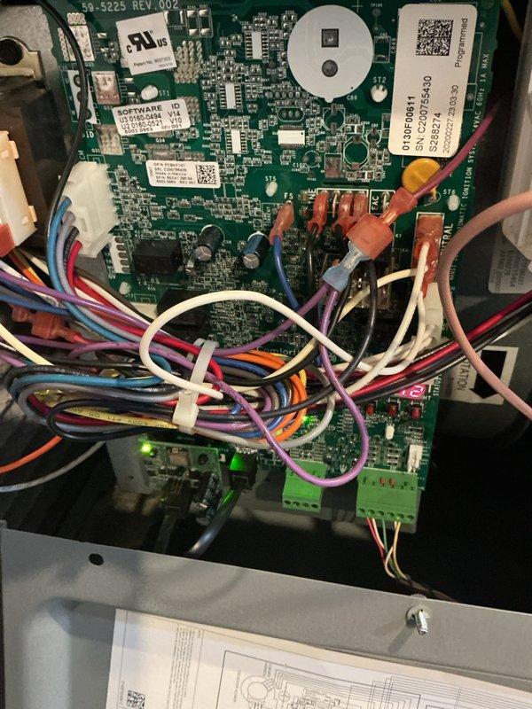 Responded to emergency no-heat call for a 5-6 year old HVAC system. Diagnostic inspection revealed significant corrosion on the metal housing components and electrical connections. Identified faulty control board (50-5225 REV.002) with visible signs of moisture damage, replaced board and restored system operation.