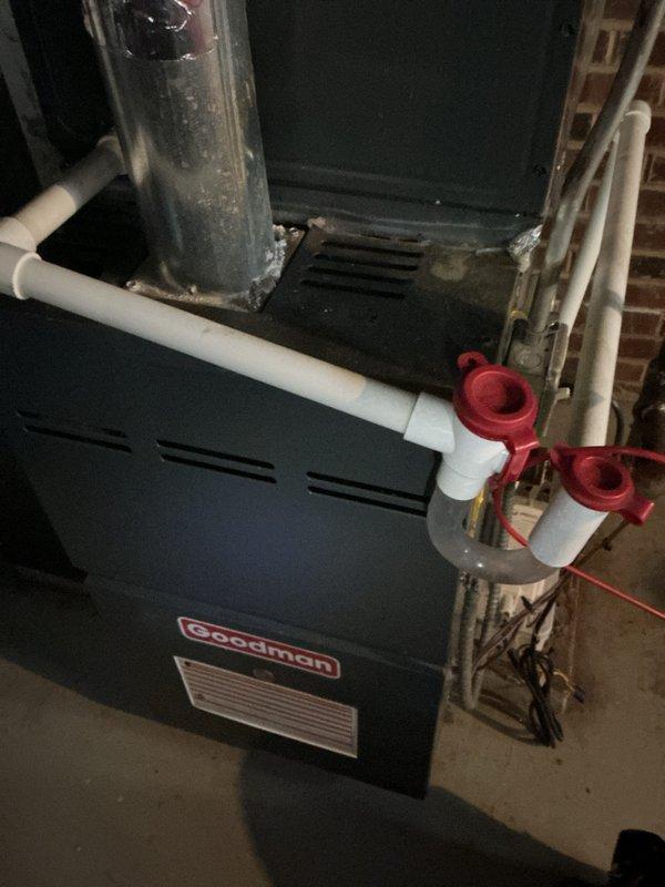 Performed routine heating maintenance on Goodman furnace system. Inspected and noted existing HDX air filter showing normal dust accumulation. Checked all PVC venting connections, shut-off valves, and exhaust flue for proper operation and integrity.