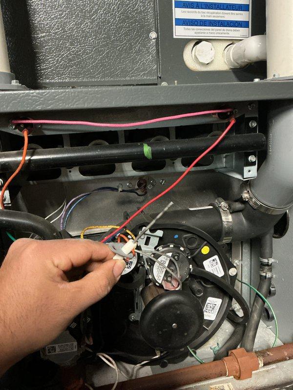 Performed monthly heating maintenance on 8-year-old HVAC system. Inspected and tested electrical connections throughout the unit, with particular attention to the blower motor assembly and wiring harness. Examined copper piping and gas valve for normal operation, confirming all components are functioning properly despite normal aging of copper components.