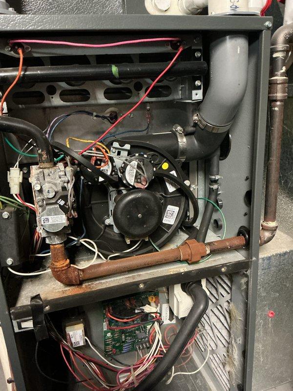 Performed monthly heating maintenance on 8-year-old HVAC system. Inspected and tested electrical connections throughout the unit, with particular attention to the blower motor assembly and wiring harness. Examined copper piping and gas valve for normal operation, confirming all components are functioning properly despite normal aging of copper components.