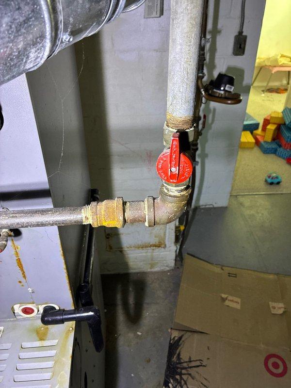 Conducted comprehensive assessment of existing heat pump system and surrounding infrastructure. Inspected exterior electrical connections and junction box mounted on vinyl siding. Evaluated interior plumbing components, noting aging copper pipes with visible oxidation at joints and functional red valve handle. Presented replacement heat pump options to customer based on findings.