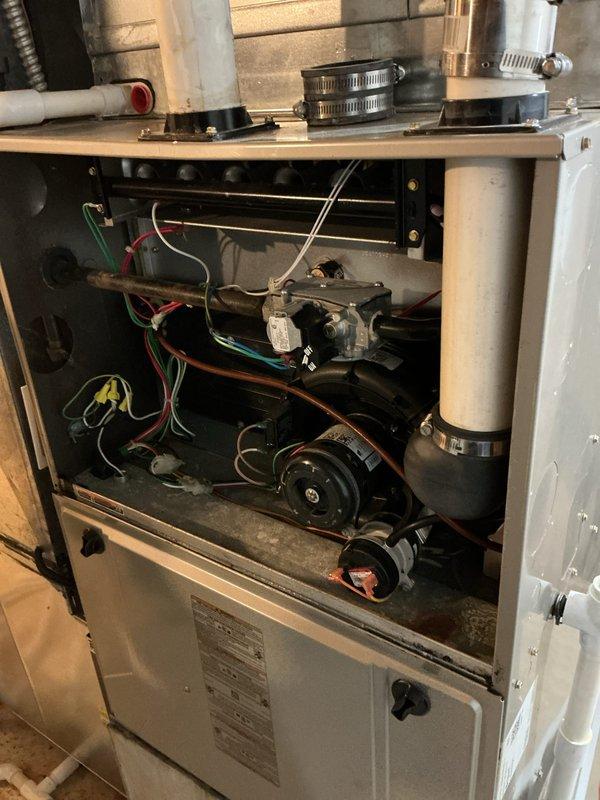 Conducted scheduled heating tune-up service on residential HVAC system. Inspected internal components including motor assembly, electrical connections, and ventilation system. Cleaned accumulated dust from interior components and verified proper operation of all mechanical and electrical systems.