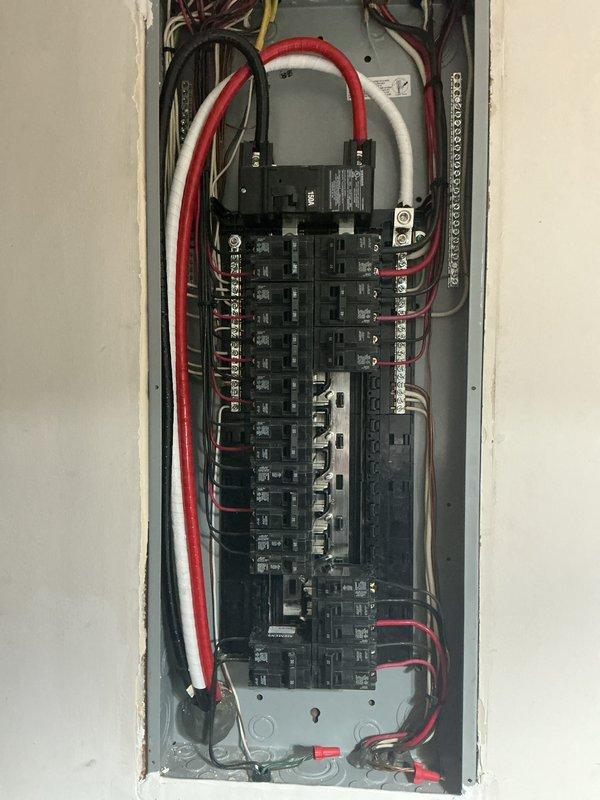 Conducted electrical inspection of main service panel with focus on intermittent breaker tripping issues related to previously installed tankless water heater. Visual inspection revealed properly installed circuit breakers and wiring with no signs of damage, overheating, or anomalies that would explain the tripping incidents.