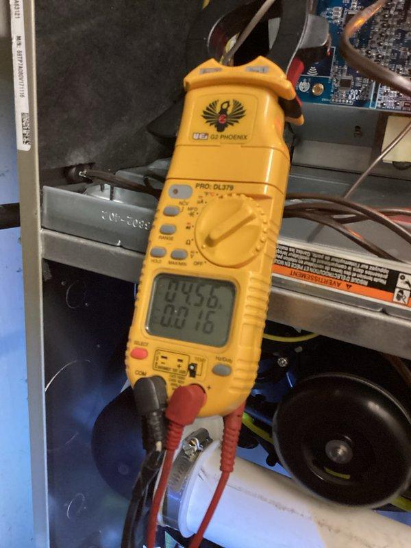 Performed scheduled heating maintenance, including electrical system diagnostics with clamp meter (UEi PRO-DL379) measuring 84.5V/60.16A readings. Inspected internal components including heat exchanger fins and refrigerant lines for proper condition and operation. All systems functioning within normal parameters.