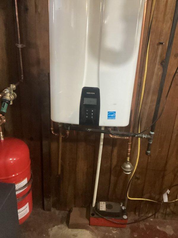 Performed comprehensive electrical inspection on tankless Navien water heater installation after customer reported recurring fuse issues. Identified and corrected improper wiring connections at the unit, inspected ceiling electrical conduit routing, and verified proper grounding. All electrical components now functioning correctly with no further circuit interruptions.