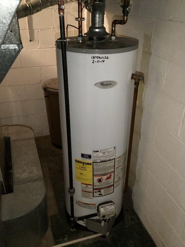 Replaced aging Whirlpool water heater (originally installed 2-11-19) due to diminished heating performance and brown water discharge. Installed new tanked water heater with proper connections to existing copper supply lines and vent pipe. System now functioning with clear water output and optimal heating capability.