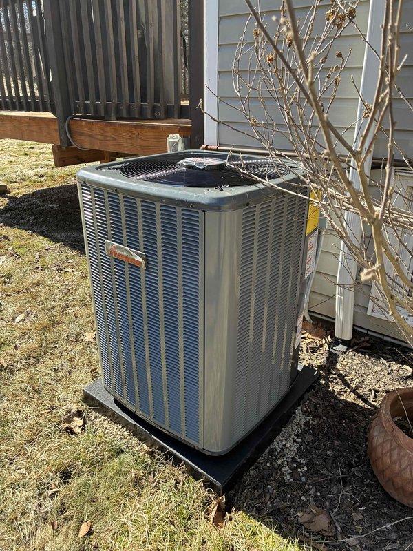 Successfully installed complete HVAC system including Amana 80% efficiency furnace with proper ductwork and metal exhaust venting in utility area. Exterior installation of Trane condensing unit completed on level pad with all necessary connections to create a fully functional heating and cooling system.