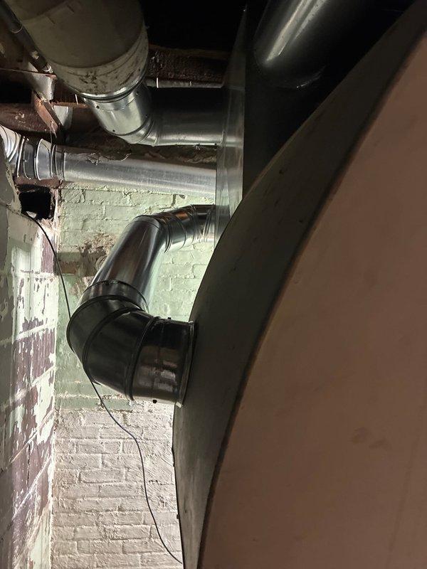 Successfully completed installation of dual 96% efficiency furnaces with Aprilaire humidifiers in basement utility area. System includes properly connected sheet metal ductwork, PVC venting, and all necessary electrical connections. Final inspection confirmed proper operation of both heating units and humidification systems.