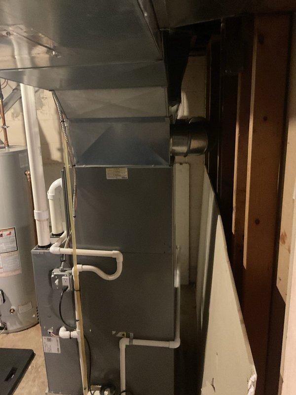 Completed routine heating maintenance service on Comfort-Aire/Division furnace system located in basement utility room. Inspected all components including PVC exhaust/intake pipes, condensate drain line, electrical connections, and associated ductwork. System was found to be in proper working condition with no issues identified.