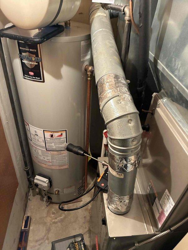 Performed routine heating maintenance service on residential HVAC system. Inspected water heater and associated copper piping connections. Replaced air filters with new pleated filters to ensure optimal system performance and air quality.