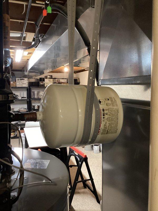 Completed scheduled maintenance on A.O. Smith tanked water heater, performing a comprehensive flush and fill service to remove sediment buildup. Properly drained system using appropriate containment method, then refilled and verified proper operation of the unit in basement utility area.