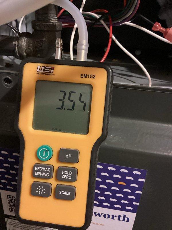 Performed scheduled heating maintenance on furnace system. Conducted comprehensive inspection of blower motor assembly, electrical connections, and control board. Measured system pressure readings (3.54) with UEI EM152 digital meter to verify proper operation within manufacturer specifications.