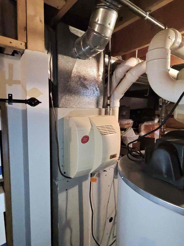 Performed scheduled heating maintenance on two HVAC systems. Inspected basement furnace unit with associated ductwork, PVC venting, and condensate lines, confirming proper installation and operation. Examined ventilation fan unit, noting metal blade integrity but identifying rust formation on interior housing that will require monitoring during future maintenance visits.