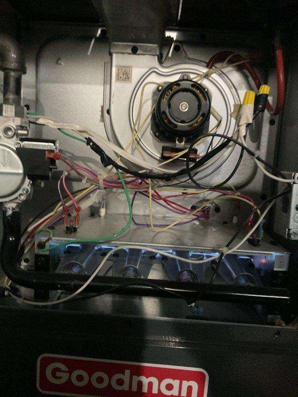 Performed first-year heating maintenance on Goodman system. Inspected internal electrical components, verifying proper wire connections and control functionality. Examined furnace installation in utility area, confirming appropriate ductwork connections and ventilation pathways.