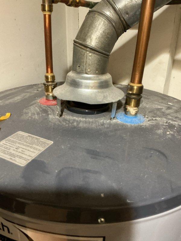 Performed routine maintenance service on A.O. Smith water heater system. Inspected copper hot/cold water lines, brass fittings, and central galvanized vent pipe for proper connections and signs of wear. Verified unit was functioning correctly with no visible damage or deterioration to tank or plumbing components.