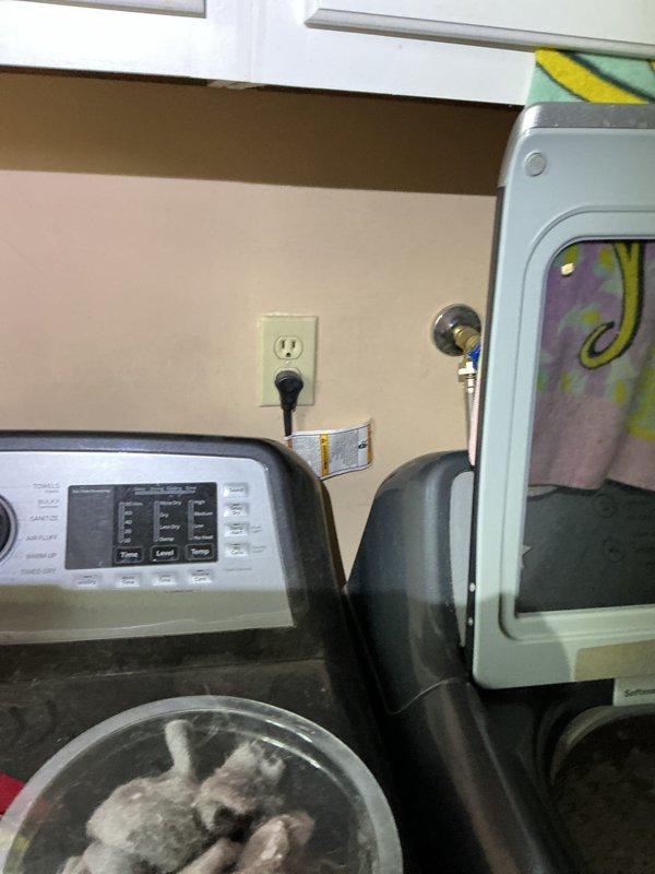 Conducted comprehensive electrical inspection of residential laundry room and basement utility area. Examined wall outlet connections for washer/dryer setup and inspected junction box in basement area, noting visible moisture damage on surrounding concrete walls. Documented conditions with photos for complete assessment.