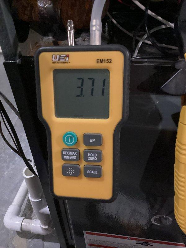Performed comprehensive heating tune-up service on two systems. Conducted electrical measurements using UEi Phoenix clamp meter (PRO-DL379), recording current readings of 0.290 and 0.045 amps. Verified gas pressure parameters with UEi EM152 digital manometer, which displayed 3.77" WC, confirming proper operation of both heating units.