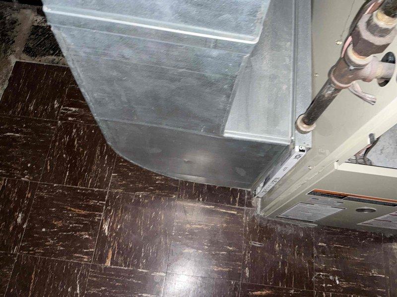 Conducted diagnostic assessment of no-heat complaint, documented existing ceiling-mounted air handler with connecting ductwork and refrigerant lines. Evaluated system condition and presented replacement options to customer.