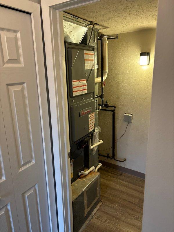 Successfully installed a 96% efficiency Koch furnace and AC system in the utility closet. System includes properly connected PVC ventilation pipes, copper line set with appropriate valves, and all required safety labels. Unit placement allows for adequate service access and the installation area was left clean and organized.
