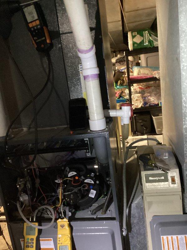 Conducted routine heating system maintenance including visual inspection of furnace components and connections. Performed combustion analysis with Testo 310 analyzer, confirming proper operation with temperature reading of 100.5°F and O₂ level at 5.0%. System is functioning within normal parameters.