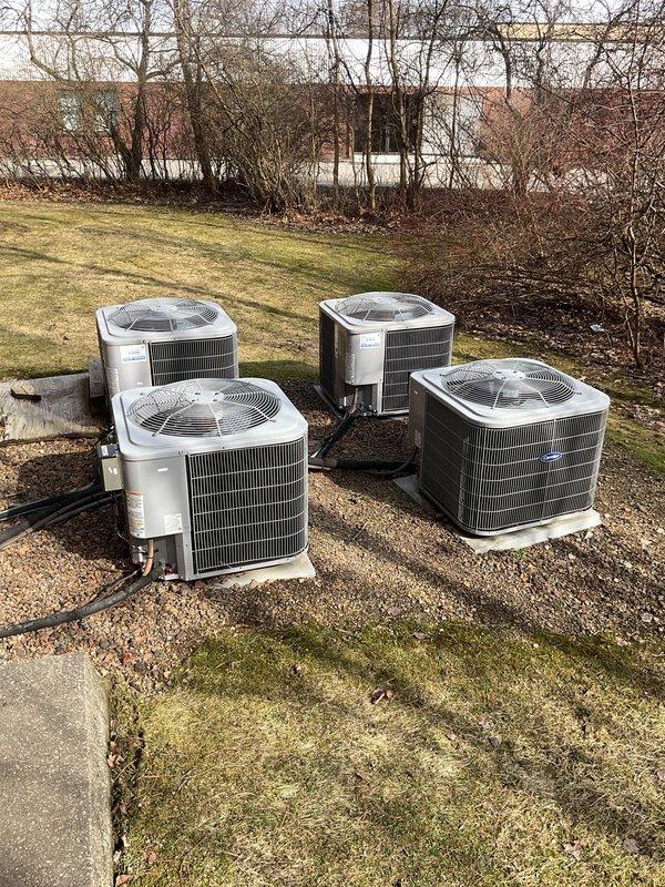 Conducted site assessment of four outdoor heat pump/AC units and associated electrical service connections for potential commercial maintenance agreement. Documented current installation configuration including multiple conduit lines, service panels, and exterior unit placement. Customer expressed interest in establishing regular maintenance service for the commercial HVAC system.