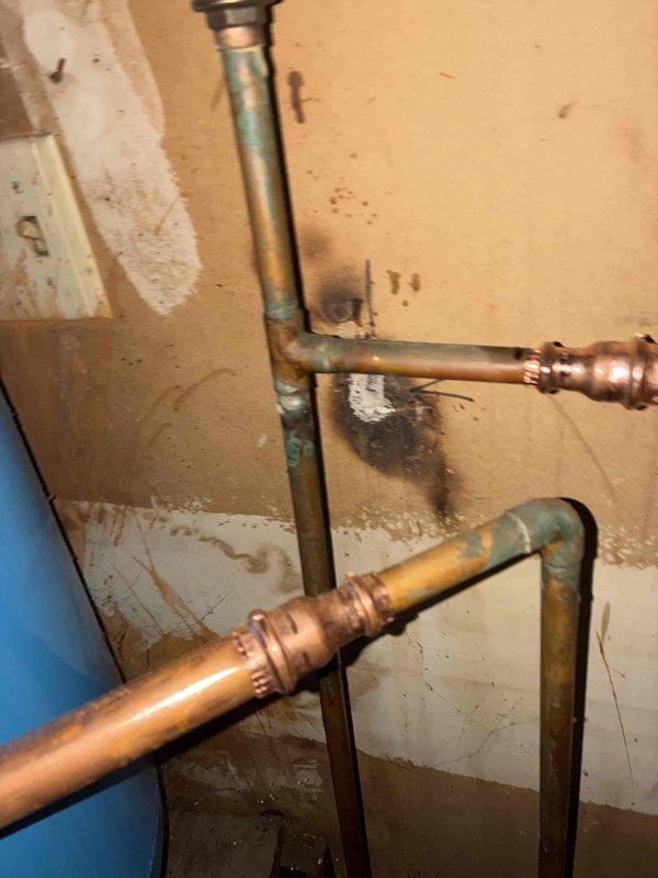 Responded to service call regarding hot water flowing into toilet. Diagnosed cross-connection issue between newly installed Bradford White water heater (installed on 3/2/26) and toilet supply line. Corrected improper pipe connections at water heater manifold, eliminating thermal mixing problem and restoring proper cold water flow to toilet fixture.