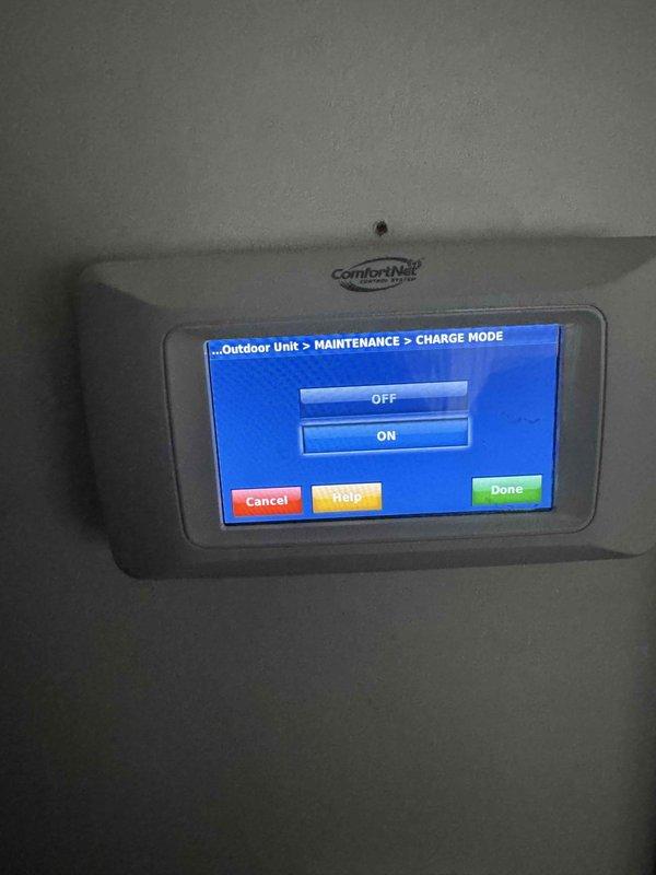 Performed refrigerant recharge service on outdoor condensing unit and conducted comprehensive leak detection. Unit required deep vacuum pull prior to recharging. Successfully restored system operation by activating charge mode through ComfortNet thermostat interface after condensing coil replacement.