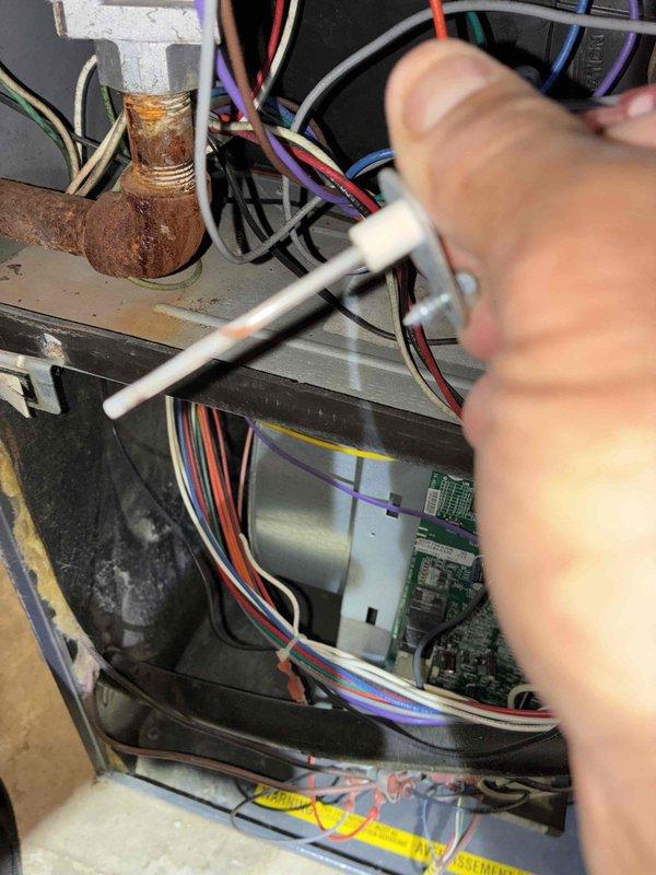 Performed annual heating maintenance on system. Inspected electrical connections and components, noting significant corrosion on copper fitting that requires monitoring. Examined blower wheel assembly which showed moderate dust accumulation but remains operational.