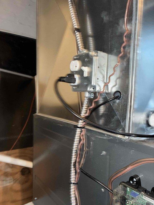 Conducted scheduled heating maintenance service on furnace system. Inspected control board wiring connections and verified proper wire routing/securing with zip ties. Examined junction box installation and confirmed integrity of flexible metal conduit and refrigerant line positioning.