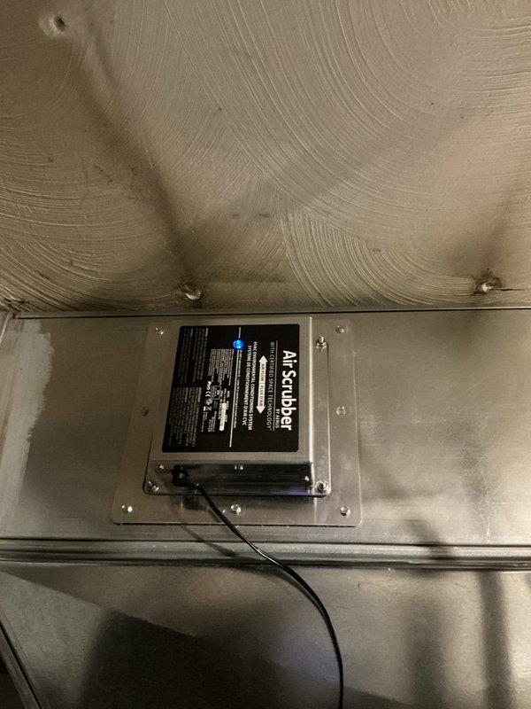 Responded to no heat complaint where thermostat was not communicating with furnace. Observed Air Scrubber device properly installed on ductwork. Restored communication between thermostat and furnace, restoring heating functionality.
