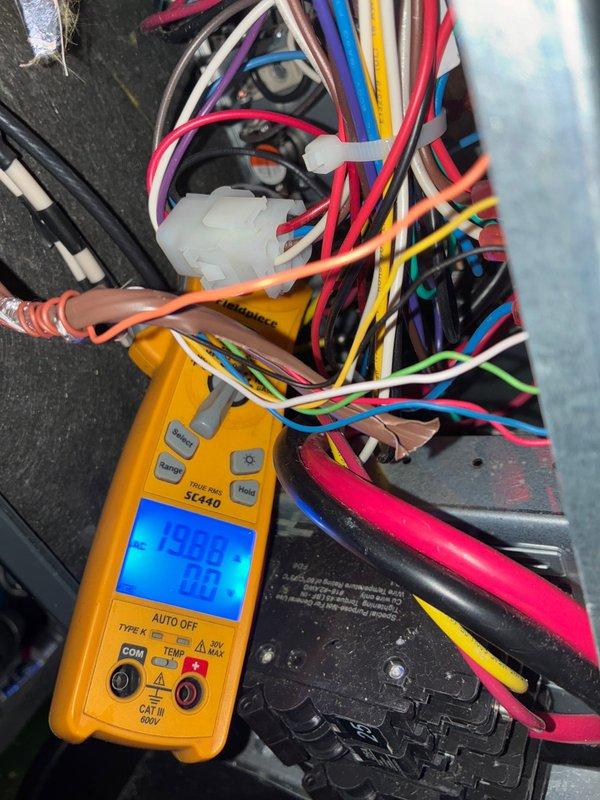 Performed diagnostic testing on thermostat wiring to air handler, using multimeter to verify proper voltage readings (15.6V). Successfully connected and configured Honeywell Home smart thermostat, confirming system communication and functionality.