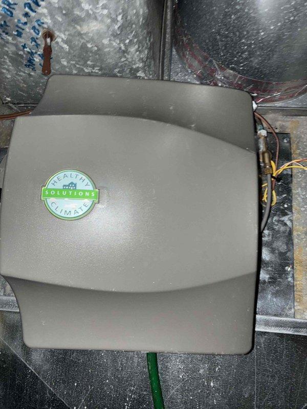 Investigated customer-reported humidifier malfunction that remained unresolved from previous service visit. Inspected Healthy Climate humidifier installation, examining connections and wiring. Found improper mounting at corner joint causing operational failure, corrected installation position and secured fasteners properly to restore humidifier functionality.