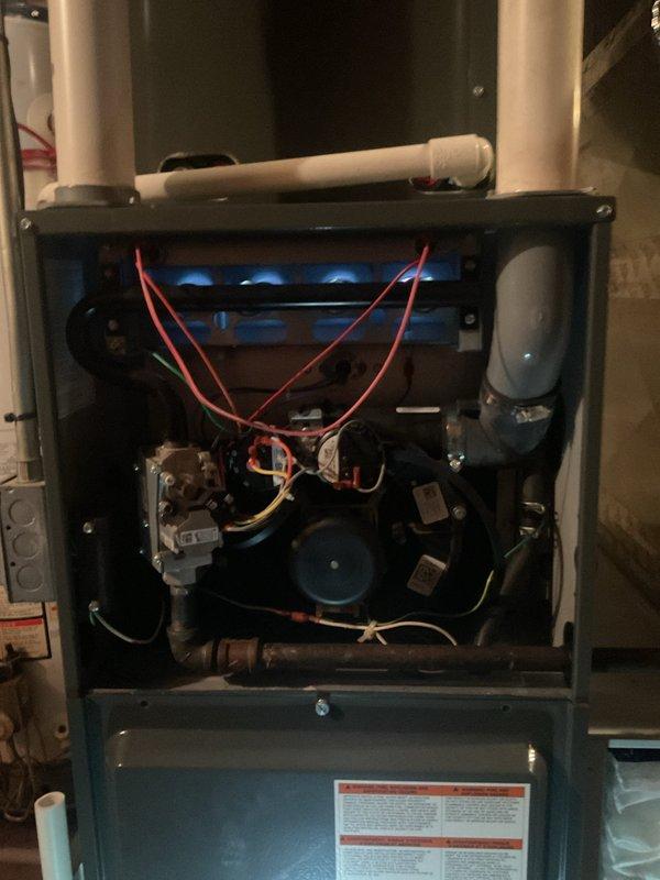 Performed routine heating maintenance on gas furnace system in utility area. Inspected internal components including heat exchanger, burner assembly, blower motor, and electrical connections. System was tested for proper operation and is functioning correctly with no issues identified.