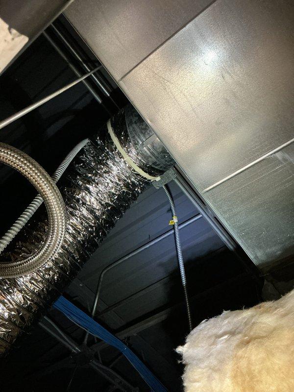 Responded to follow-up service call regarding persistent noise from commercial furnace system. Inspected attic space to evaluate previous technician's damper adjustment which had initially reduced noise. Identified additional resonance points in the flexible metal ductwork and secured loose connections between the main trunk and distribution boxes, successfully eliminating the noise complaint.