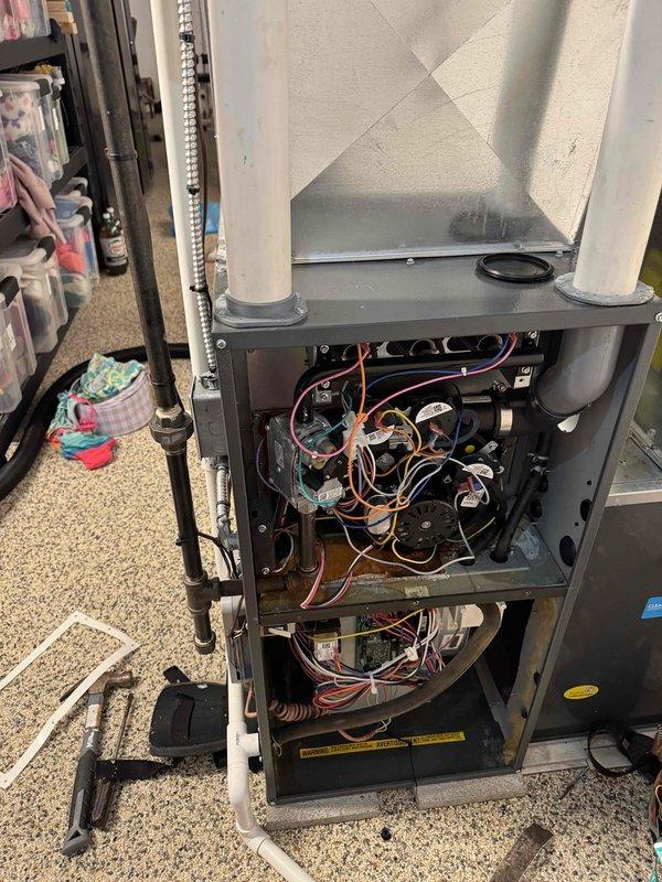 Completed scheduled repair service by replacing the collector box and inducer motor on the customer's furnace. Opened access panel to gain entry to internal components, disconnected electrical connections and mounting hardware, then installed new parts to restore proper system operation. Verified proper function of the unit after repair completion.