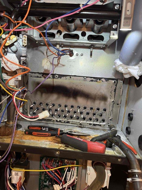 Completed scheduled repair service by replacing the collector box and inducer motor on the customer's furnace. Opened access panel to gain entry to internal components, disconnected electrical connections and mounting hardware, then installed new parts to restore proper system operation. Verified proper function of the unit after repair completion.