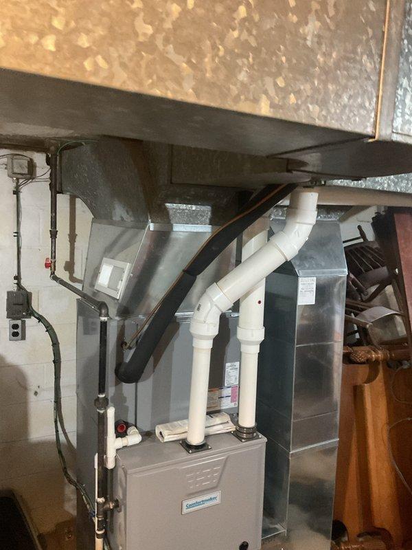 Performed routine heating maintenance on Comfortmaker furnace system. Inspected all components including PVC ventilation pipes, ductwork connections, and electrical junctions. System operating within normal parameters; no issues detected.